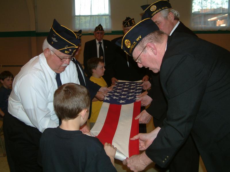 Cub Scouts in St. Albans Given Instructions on Flag Folding