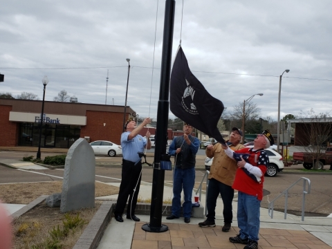 Veterans raise POW/MIA flag at courthouse