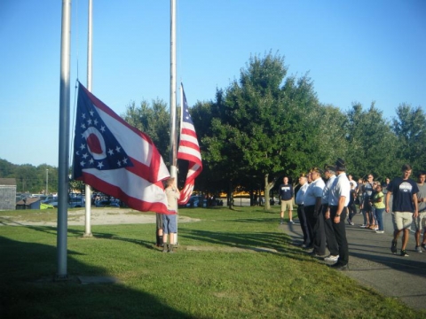 raising the flag at Granville H.S football games