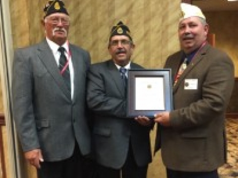 stan receiving Citizenship Medal